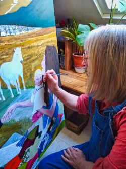 Jenny Phillips painting in her studio